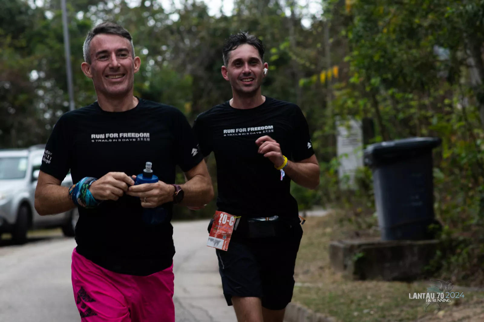 Jo and friend Angus training together in Run for Freedom shirts