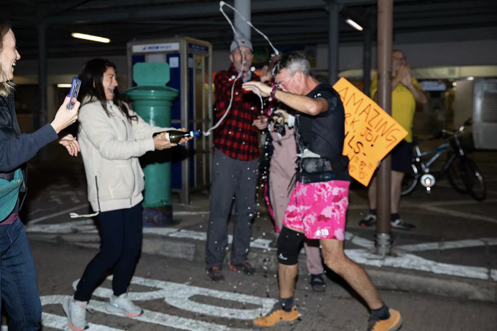 Jo Lodder sprays champagne after completing his 400km 5in5 world first
